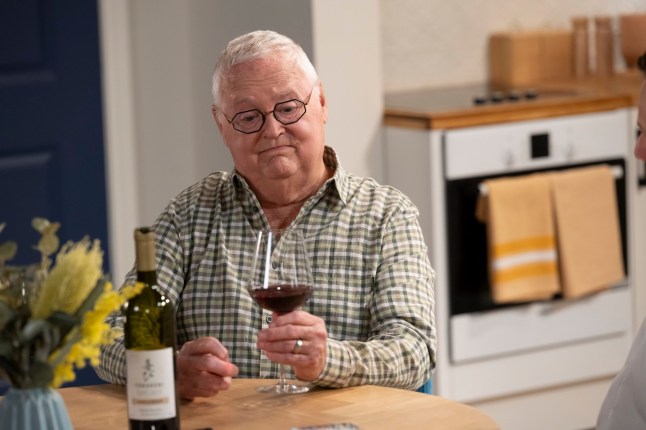 Harold Bishop with a glass of wine in Neighbours