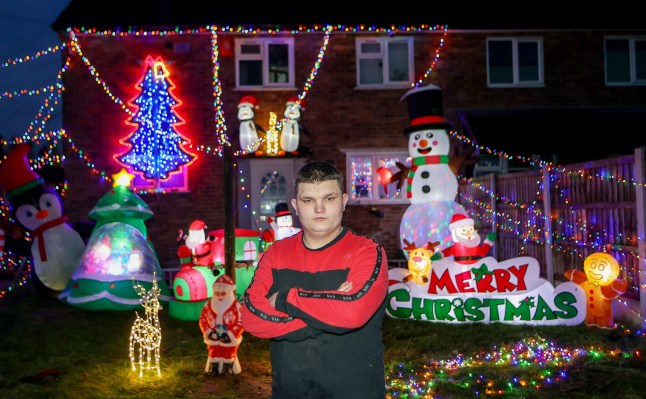 Michael Stonier outside his home in Blythe Bridge, Stoke-on-Trent, with his Christmas lights display. December 3, 2024. A family has slammed 'Scrooge' housing bosses following complaints their Christmas display is keeping residents awake and causing LIGHT POLLUTION. Each year the Stonier family turn their home into a festive winter wonderland featuring 7,000 lights and inflatables in a tradition dating back 23 years. They say delighted children flock to see the display which covers their property in Stoke-on-Trent, Staffs., after spending ??10,000 on it over the years. But Michael Stonier, 21, said he was left stunned when they got a letter from social housing bosses trying to impose restrictions on this year's lights. They said some neighbours had complained about light pollution causes by the display which was also stopping them from getting to sleep. Homes Plus Group told him they must be switched off by 10pm each night and even ordered him not to put them up too early.