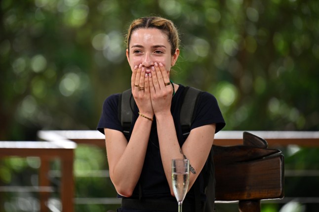 GK Barry holds hands over face in black t-shirt in jungle