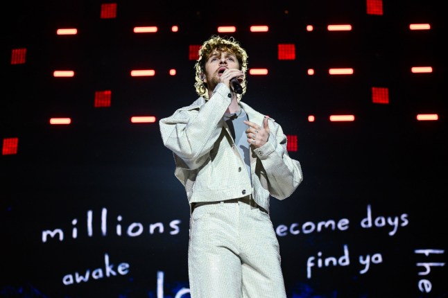 Tom Grennan performing on stage at Capital's Jingle Bell Ball 2024