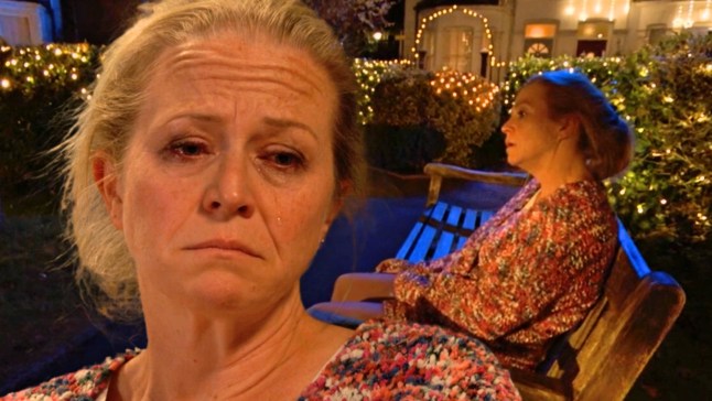 Linda Carter up-close, crying while drunk, and sitting on a bench looking lost