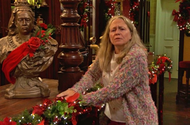 EastEnders picture shows Linda, drunk and upset, propping herself up at the edge of the bar in the Queen Vic