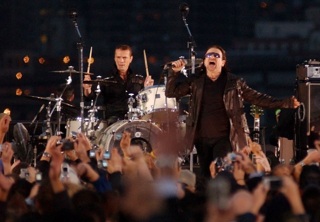 Mandatory Credit: Photo by Jason Decrow/EPA/REX/Shutterstock (7846983c) Lead Singer Bono (r) and Drummer Larry Mullen (l) of the Irish Rock Group U2 Perform a Free Concert For Fans at Empire-fulton Ferry Landing Beneath the Brooklyn Bridge in Brooklyn New York Monday 22 November 2004 the Group Performed a 30-minute Free Concert After Filming a Video in New York City Earlier in the Day Usa U2 Concert - Nov 2004