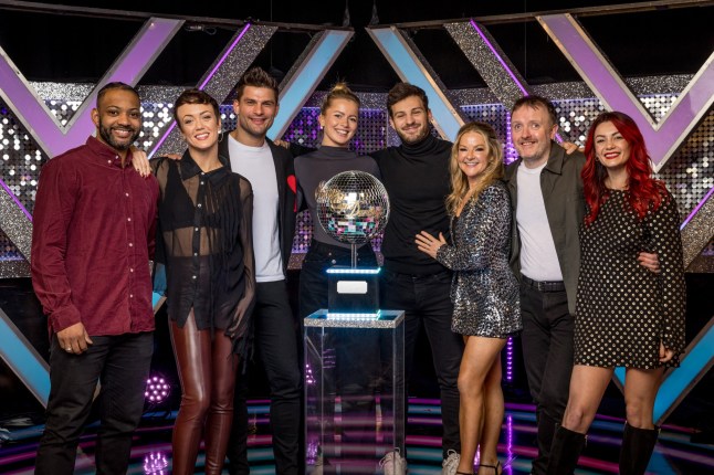 Strictly Come Dancing 2024 finalists (left to right) JB Gill and Lauren Oakley , Aljaz Skorjanec and Tasha Ghouri, Vito Coppola and Sarah Hadland, Chris McCausland and Dianne Buswell. They are all stood around the glitterball trophy