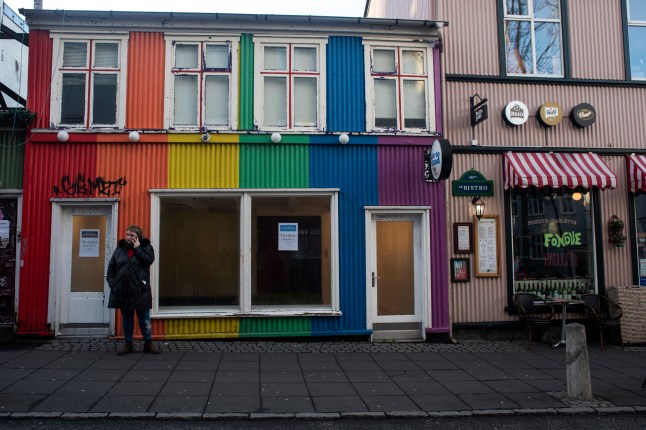 A woman speaks on her smartphone, in one of the streets of downtown Reykjavik (Iceland) (Photo by Joaquin Gomez Sastre/NurPhoto via Getty Images)