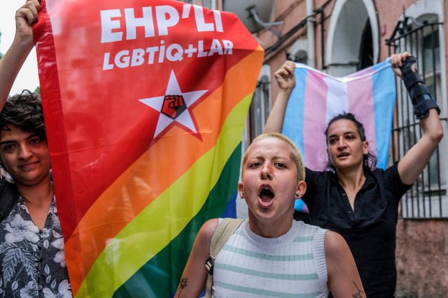 ISTANBUL, TURKEY - 2023/06/18: A protester chants slogans while the colleagues hold flags along the street. The "Pride Parade" planned to be held by LGBT in Taksim has been banned with the statement made by the Istanbul Governor's Office. In the statement of the Governor's Office, it was stated that "Considering the safety and public order of the citizens and tourists who will be in the region for the purpose of sightseeing, meetings, demonstration, marches will not be allowed. (Photo by Mine Toz/SOPA Images/LightRocket via Getty Images)