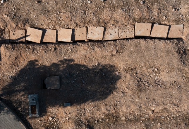 DAMASCUS, SYRIA - DECEMBER 16: An aerial view of the mass grave, where the remains of bodies believed to be those of civilians killed by the regime of Bashar al-Assad, in the Baghdad Bridge area outside the Syrian capital Damascus on December 16, 2024. (Photo by Emin Sansar/Anadolu via Getty Images)