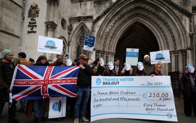 epa11782235 Protesters carry placards during a Thames Water bailout protest at the High Court in London, Britain, 17 December 2024. Protesters gathered outside London???s High Court against a Thames Water bailout that would see customers pay an extra 250 British pounds a year to rescue the failing water company. EPA/ANDY RAIN