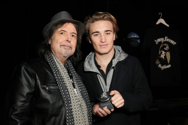 Phil Campbell with Lemmy's son Marcus holding the urn that contains part of the ashes of Lemmy from Motorhead