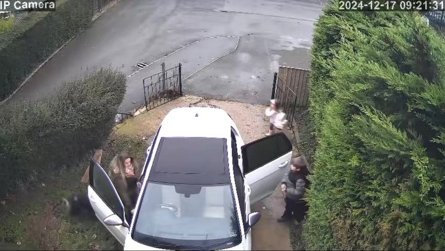 PIC FROM KENNEDY NEWS AND MEDIA (PICTURED: PIC FROM BETHAN WALKER'S CAMERA SHOWING COREY WALKER, 12, PLUMMETING DOWN AN OPEN MANHOLE ON HIS OWN DRIVEWAY WITH MUM BETHAN WALKER, 31, AND SISTER DOLCIE WILLIAMS, 3) This is the moment a schoolboy plummets down an open manhole on his own driveway - that is 'fuming' mum claims Thames Water workers left open. Footage shows 12-year-old Corey Walker walking to get into his car before he screams and falls down an exposed manhole in his driveway, suddenly disappearing from view. His mum Bethan Walker says she is 'absolutely fuming' as she claims Thames Water workers left the drain uncovered. DISCLAIMER: While Kennedy News and Media uses its best endeavours to establish the copyright and authenticity of all pictures supplied, it accepts no liability for any damage, loss or legal action caused by the use of images supplied and the publication of images is solely at your discretion. SEE KENNEDY NEWS COPY - 0161 697 4266