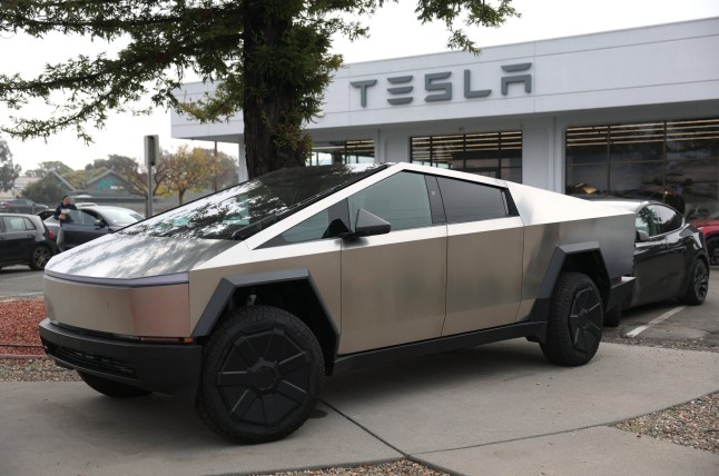 CORTE MADERA, CALIFORNIA - DECEMBER 20: A Tesla Cybertruck is displayed at a Tesla dealership on December 20, 2024 in Corte Madera, California. Electric car maker Tesla is recalling 700,000 vehicles over a tire pressure warning system that could fail to warn drivers of low tire pressure. 2024 Cybertrucks, 2017-2025 Model 3 and 2020-2025 Model Y are being recalled. (Photo by Justin Sullivan/Getty Images)