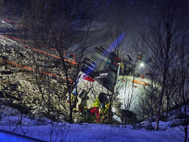 Rescuers work at the site where a bus went off the road on the E10 in Hadsel in Nordland, Norway, Thursday Dec. 26, 2024. (Marius Birkeland/NTB Scanpix via AP)