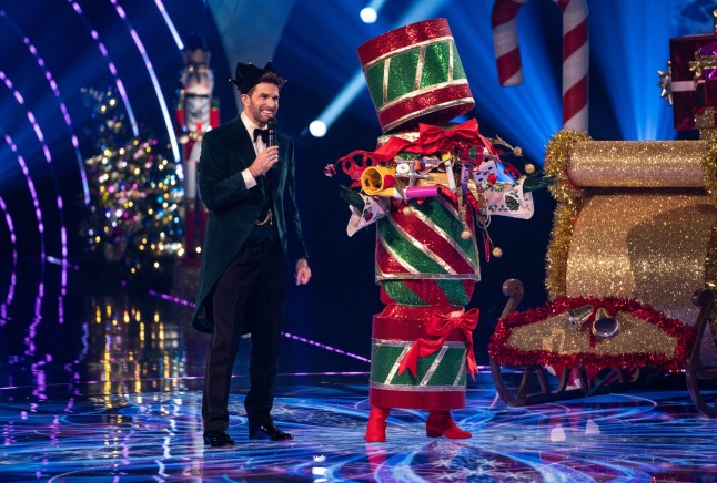 This image and the information contained herein is strictly embargoed until 20:00 Sunday 8th December 2024 From Bandicoot TV The Masked Singer Christmas Special:on ITV1 and ITVX Pictured: Joel Dommet & Cracker This photograph is (C) Bandicoot TV and can only be reproduced for editorial purposes directly in connection with the programme or event mentioned above, or ITV plc. This photograph must not be manipulated [excluding basic cropping] in a manner which alters the visual appearance of the person photographed deemed detrimental or inappropriate by ITV plc Picture Desk. This photograph must not be syndicated to any other company, publication or website, or permanently archived, without the express written permission of ITV Picture Desk. Full Terms and conditions are available on the website www.itv.com/presscentre/itvpictures/terms For further information please contact: michael.taiwo1@itv.com