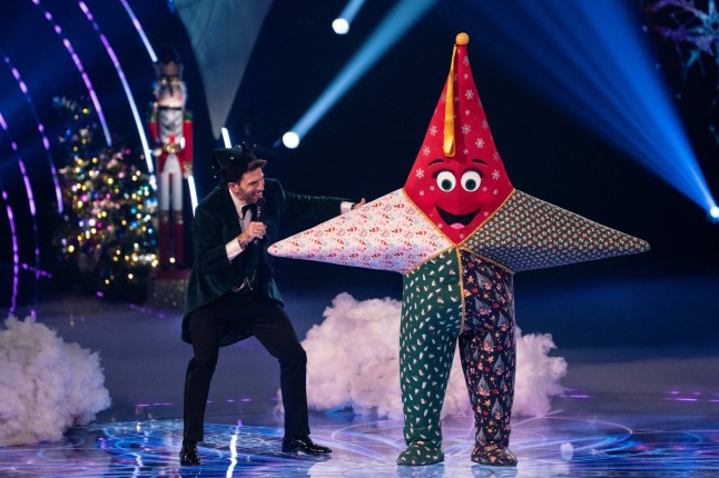 This image and the information contained herein is strictly embargoed until 20:00 Sunday 8th December 2024 From Bandicoot TV The Masked Singer Christmas Special:on ITV1 and ITVX Pictured: Joel Dommet & Star This photograph is (C) Bandicoot TV and can only be reproduced for editorial purposes directly in connection with the programme or event mentioned above, or ITV plc. This photograph must not be manipulated [excluding basic cropping] in a manner which alters the visual appearance of the person photographed deemed detrimental or inappropriate by ITV plc Picture Desk. This photograph must not be syndicated to any other company, publication or website, or permanently archived, without the express written permission of ITV Picture Desk. Full Terms and conditions are available on the website www.itv.com/presscentre/itvpictures/terms For further information please contact: michael.taiwo1@itv.com