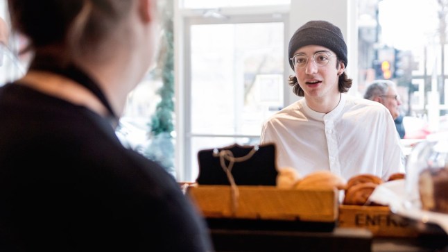 A man ordering food at a counter