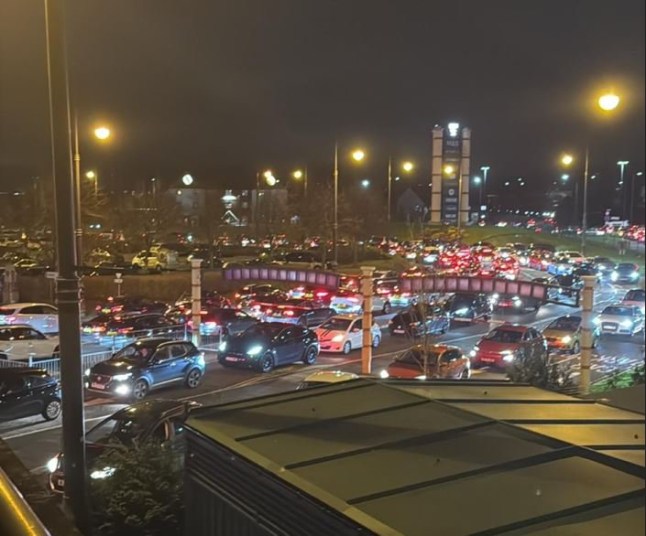 Children were left crying as fights broke out at the Trafford Centre with motorists stuck in the car park for up to FIVE HOURS. Shoppers said yesterday's (Dec 30) traffic chaos was so bad that some cars were unable to even leave the spaces in which they had parked. Caption: Traffic chaos at the Trafford Centre in Trafford Park, Greater Manchester, on 30 December 2024