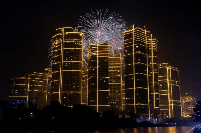 Fireworks explode over Rockwell Center in celebration of the New Year in Mandaluyong City, Metro Manila, Philippines,