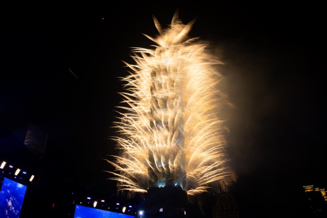 TAIPEI, TAIWAN - JANUARY 01: Fireworks light up the Taiwan skyline and Taipei 101 during New Year's Eve celebrations on January 01, 2025 in Taipei, Taiwan. (Photo by Gene Wang/Getty Images)