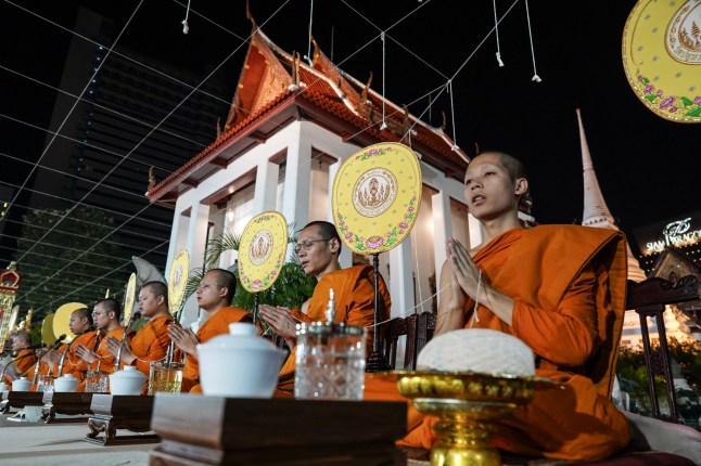 Mandatory Credit: Photo by Anusak Laowilas/NurPhoto/Shutterstock (15058408h) Buddhist monks chant during an auspicious prayer rite to welcome the upcoming new year at Wat Pathum Wanaram temple in Bangkok, Thailand, on December 31, 2024. Thai people across the country celebrate New Year's Eve to welcome the year of the snake. People Celebrate The New Year's Eve In Bangkok, Thailand - 31 Dec 2024