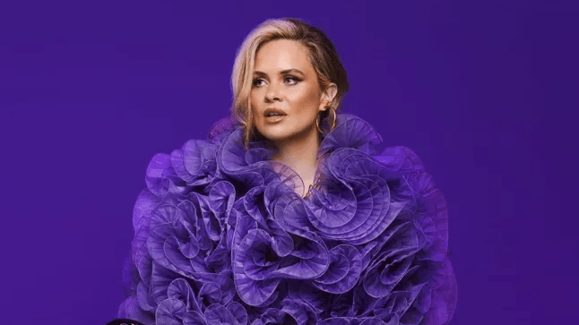 Joanne McNally wearing purple ruffles on a purple background