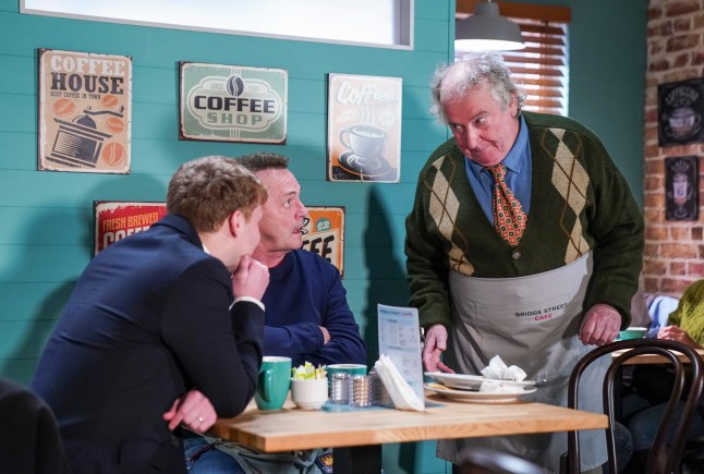 Nigel talks to Billy and Jay in the cafe in EastEnders