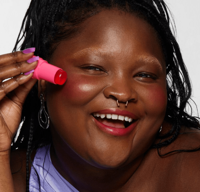 Image of model applying Milk Makeup Cooling Water Jelly Tint tp her cheeks and lips