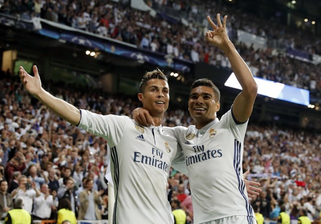 MADRID, SPAIN - MAY 02: Cristiano Ronaldo (L) of Real Madrid celebrates with Casemiro their team's third goal during the UEFA Champions League Semi Final first leg match between Real Madrid CF and Club Atletico de Madrid at Estadio Santiago Bernabeu on May 2, 2017 in Madrid, Spain. (Photo by Angel Martinez/Real Madrid via Getty Images)