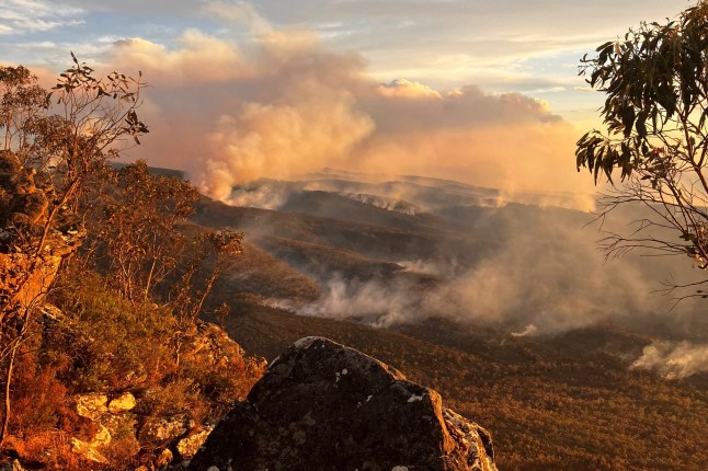 Smoke billows from a blaze in Grampians National Park, Victoria, Australia in this undated handout photo released on December 28, 2024. AAP/Supplied State Control Centre via REUTERS ATTENTION EDITORS - THIS IMAGE WAS PROVIDED BY A THIRD PARTY. NO RESALES. NO ARCHIVE. NEW ZEALAND OUT. AUSTRALIA OUT. NO COMMERCIAL OR EDITORIAL SALES IN NEW ZEALAND AND AUSTRALIA.