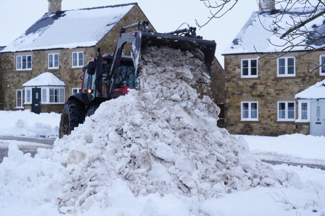 Snow is cleared in Catton, Northumberland. Weather warnings remain in force across much of the UK on Monday with adverse conditions, including flooding from heavy rain and thawing snow. Picture date: Monday January 6, 2025. PA Photo. Photo credit should read: Owen Humphreys/PA Wire