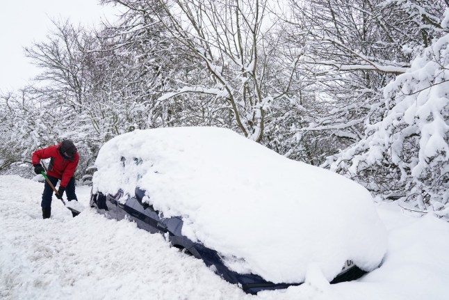 A man digs a car out of the snow near Allenheads, in the Pennines in Northumberland. Weather warnings remain in force across much of the UK on Monday with adverse conditions, including flooding from heavy rain and thawing snow. Picture date: Monday January 6, 2025. PA Photo. Photo credit should read: Owen Humphreys/PA Wire