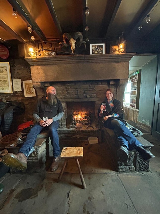 From left: Paul and Naomi Wright at the Tan Hill Inn in North Yorkshire. Release date January 6 2025. More than 30 people are currently snowed in at Britain's highest pub after an Arctic blast swept across the UK. Customers who had trekked to Tan Hill Inn in North Yorkshire - which is is 528 metres (1,732 ft) above sea level - were today (Mon) still holed up in the world famous boozer. Despite amber warnings of snow, 32 guests attended the pub on Saturday night and have remained cut off ever since, along with six staff who were on duty. It comes as temperatures fell to -11.1C in some parts and the Met Office and UK Health Security Agency issued amber "danger to life" alerts ahead of the blizzards.