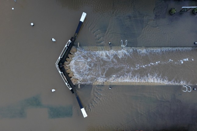 UNSPECIFIED - JANUARY 06: A lock on the River Soar is burst by flood water on January 06, 2025 in Mountsorrel, Leicestershire. The Met has issued a yellow weather warning for rain across southern parts of England, as storms bring more wintery wet weather into Monday. (Photo by Michael Regan/Getty Images)