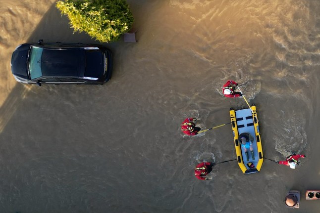 A man is rescued from the flooding at a caravan park near Barrow upon Soar, Leicestershire. Weather warnings for snow and ice are in force across much of the UK after severe flooding and snow caused travel disruption and school closures. Across England, there are also 198 flood warnings, meaning flooding is expected, and 300 flood alerts, meaning flooding is possible. Picture date: Tuesday January 7, 2025. PA Photo. Photo credit should read: Joe Giddens/PA Wire