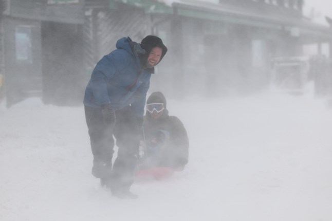 GLENSHEE - JANUARY 07: A man pulls a sledge at Glenshee Ski Centre on January 07, 2025 in Glenshee, United Kingdom. The Met Office has issued weather warnings as a cold snap sweeps across the UK, bringing bouts of ice, snow, and rain. (Photo by Jeff J Mitchell/Getty Images)