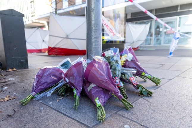 United Kingdom, Bedford 09 January 2025: Flowers at the scene of a stabbing in Bedford Bus Station. Police were called to Allhallows, Bedford at 5:50pm yesterday evening to reports of that ???a man had been seriously injured.??? A corden is still in place and a number of shops have been closed. Credit: Toby Shepheard / Story Picture Agency