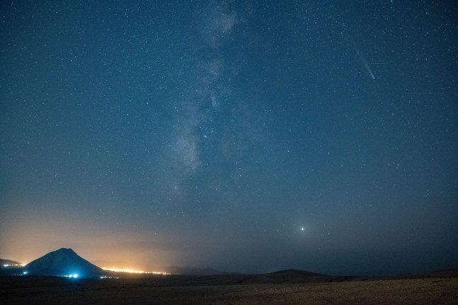 Mandatory Credit: Photo by Carlos de Saa/EPA-EFE/REX/Shutterstock (14814592b) Comet C/2023 A3 (Tsuchinshan-ATLAS) is seen crossing the sky over Tindaya Mountain in La Oliva town, Fuerteventura, Spain, 23 October 2024 (issued 24 October 2024). Comet C/2023 A3 Atlas Tsunchinshan crosses the sky over Fuerteventura, Spain - 23 Oct 2024