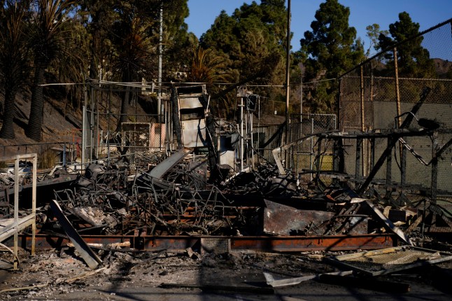 Buildings near athletic fields are burned at Palisades High School in the aftermath of the Palisades Fire in the Pacific Palisades neighborhood of Los Angeles, Tuesday, Jan. 14, 2025. (AP Photo/Carolyn Kaster)