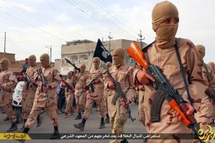 Young ISIS fighters, known as "caliphate cubs," on parade after graduating religious school near Mosul, Iraq on April 25.