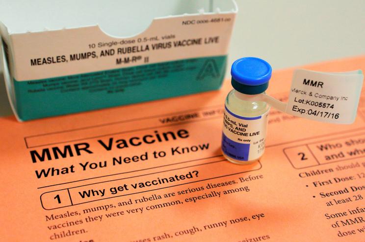 FILE PHOTO: A vial of measles, mumps and rubella vaccine and an information sheet is seen at Boston Children's Hospital in Boston, Massachusetts February 26, 2015. REUTERS/Brian Snyder/File Photo