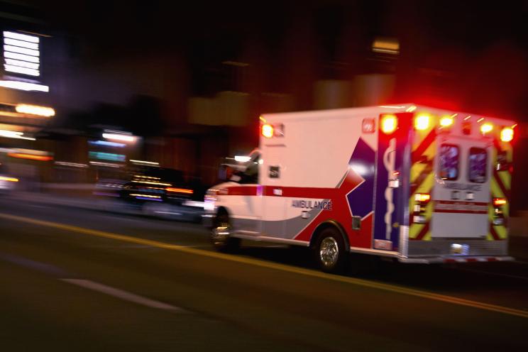 Ambulance speeding down road.