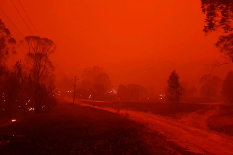 Fire and thick smoke remains the village of Nerrigundah, Australia.