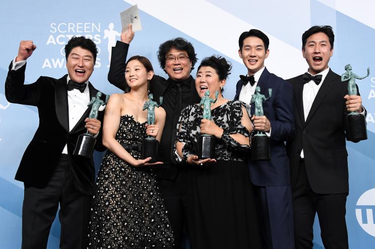 Kang-Ho Song, Park So-dam, Bong Joon-ho, Lee Jung Eun, Lee Sun Gyun and Choi Woo-shik celebrate their 2020 SAG Award for Outstanding Performance by a Cast in a Motion Picture for "Parasite."