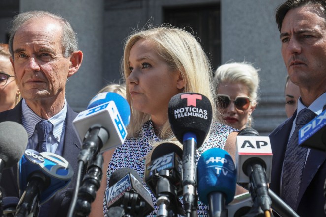 Virginia Roberts Giuffre, center, speaks at a news conference outside a Manhattan court in 2019.