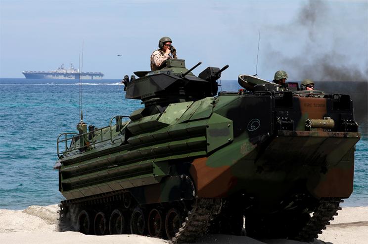 U.S. Marines ride an amphibious assault vehicle during the amphibious landing exercises