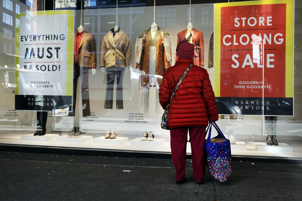 NEW YORK, NEW YORK - NOVEMBER 06: Window signs announce the first days of a liquidation sale at the iconic New York department store Barney's on November 06, 2019 in New York City. Barney's, which had been a destination stop for wealthy and fashion conscious shoppers for years, was recently sold in two parts in a $271 million deal. As part of the transaction, Barney's intellectual property will go to the licensing firm Authentic Brands Group. The closing of Barney's is another development in the crisis facing many retail stores in America as consumers shift to online shopping. (Photo by Spencer Platt/Getty Images)