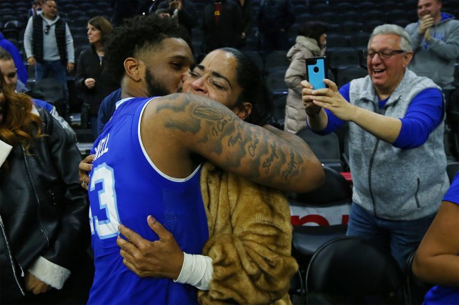 Myles Powell embraces his mother Jeanette Moore 