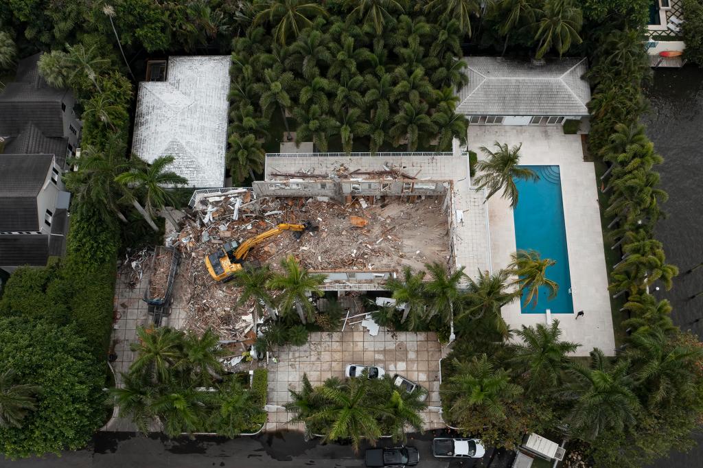 Demolition crews tear down the Palm Beach home of late financier and sex offender Jeffrey Epstein in Palm Beach, Florida on April 20, 2021.