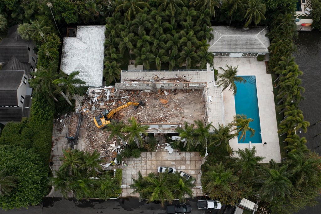 Demolition crews tear down the Palm Beach home of late financier and sex offender Jeffrey Epstein in Palm Beach, Florida on April 20, 2021. 