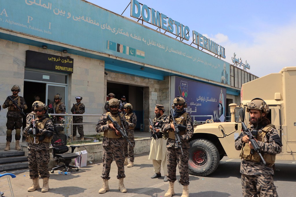 Taliban forces outside the Hamid Karzai International Airport in Kabul.