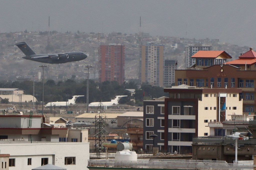 A Military aircraft takes off at the Hamid Karzai International Airport as the deadline to evacuate all troops reaches the end.